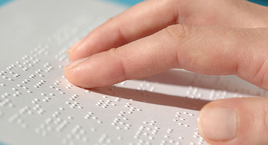 Person reading braille